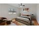 Comfortable bedroom with ceiling fan, hardwood floors, and a plush bed at 1687 Briarcliff Ne Rd # 8, Atlanta, GA 30306