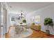 Cozy dining room with a round table, chandelier, and hardwood floors at 1687 Briarcliff Ne Rd # 8, Atlanta, GA 30306