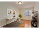 Bright home office featuring hardwood floors, modern desk, decor, and window at 1687 Briarcliff Ne Rd # 8, Atlanta, GA 30306