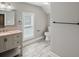 Updated bathroom features stone floors, new fixtures, and a new toilet at 1800 E Lake Rd, Mcdonough, GA 30252