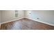 Bedroom features hard wood floors and natural light from two windows at 1800 E Lake Rd, Mcdonough, GA 30252