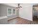 Well-lit dining room features wood floors and a modern light fixture at 1800 E Lake Rd, Mcdonough, GA 30252