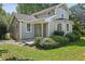 Charming two-story home with a front porch, beautiful bay window, and well-manicured landscaping at 1800 E Lake Rd, Mcdonough, GA 30252