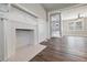 Living room features a fireplace, hardwood floors, and plenty of space at 1800 E Lake Rd, Mcdonough, GA 30252