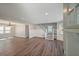 Open-concept living room boasts wood floors, recessed lighting, and a staircase leading to the upper level at 1800 E Lake Rd, Mcdonough, GA 30252