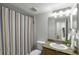 Bathroom with vanity and striped shower curtain at 2955 Seven Pines Se Ln # 203, Atlanta, GA 30339