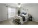 Cozy bedroom featuring a ceiling fan, natural light, and stylish decor at 2955 Seven Pines Se Ln # 203, Atlanta, GA 30339