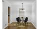 Charming dining area with modern chandelier, round table, and seating for four at 2955 Seven Pines Se Ln # 203, Atlanta, GA 30339