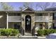 Inviting two-story condominium with stone archway entrance and balcony at 2955 Seven Pines Se Ln # 203, Atlanta, GA 30339