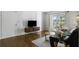 Cozy living room with hardwood floors, contemporary furniture, and ample natural light at 2955 Seven Pines Se Ln # 203, Atlanta, GA 30339