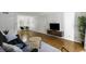 Spacious living room flowing into dining area with hardwood floors and modern furnishings at 2955 Seven Pines Se Ln # 203, Atlanta, GA 30339