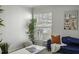 Comfortable living room with a blue sofa, natural light, and decorative accents at 2955 Seven Pines Se Ln # 203, Atlanta, GA 30339