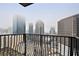 City skyline view from balcony with black iron railing in a high-rise building, showcasing urban living at 195 14Th Ne St # 2402, Atlanta, GA 30309