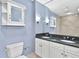 Elegant bathroom with double vanity, granite countertop, and shower featuring marble tile at 195 14Th Ne St # 2402, Atlanta, GA 30309