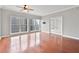 Bright living room with hardwood floors, large windows offering city views, and glass French doors at 195 14Th Ne St # 2402, Atlanta, GA 30309