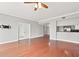 Spacious living room featuring hardwood floors, recessed lighting, and view into the kitchen at 195 14Th Ne St # 2402, Atlanta, GA 30309