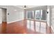 Bright living room with hardwood floors, ceiling fan, and large windows offering a city view at 195 14Th Ne St # 2402, Atlanta, GA 30309