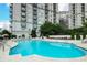Luxurious outdoor pool with lounge chairs and meticulously landscaped surroundings at 195 14Th Ne St # 2402, Atlanta, GA 30309