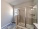 Bathroom featuring a glass-enclosed shower and neutral finishes at 2463 Quay Rdg, Lawrenceville, GA 30044