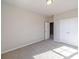 Neutral bedroom features carpet, white trim and a double door closet at 2463 Quay Rdg, Lawrenceville, GA 30044