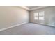 Spacious main bedroom with tray ceiling, carpet and lots of natural light at 2463 Quay Rdg, Lawrenceville, GA 30044