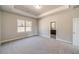 Spacious main bedroom features a tray ceiling and an en suite bathroom at 2463 Quay Rdg, Lawrenceville, GA 30044
