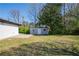 Spacious backyard featuring a storage shed and ample green space, perfect for outdoor activities and relaxation at 54 Jean Ct, Hiram, GA 30141