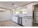 Bright kitchen showcasing subway tile backsplash, stainless steel dishwasher, and granite countertop at 54 Jean Ct, Hiram, GA 30141