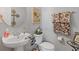 Bathroom with a toilet, sink, and designer towels at 281 Hiawassee Dr, Woodstock, GA 30188