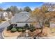Beautiful single Gathering home with mature landscaping and a manicured lawn set on a corner lot at 281 Hiawassee Dr, Woodstock, GA 30188