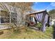 Landscaped backyard showcasing an elegant gazebo with comfortable seating, perfect for outdoor lounging and entertaining at 281 Hiawassee Dr, Woodstock, GA 30188