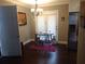 Cozy dining area with wood floors, a chandelier and a view of the backyard at 359 Cedar Ridge Trl, Lawrenceville, GA 30046