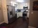 Modern kitchen with stainless steel appliances, white cabinets and tiled backsplash at 359 Cedar Ridge Trl, Lawrenceville, GA 30046