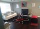Inviting living room features wood floors, a white sofa and modern decorations at 359 Cedar Ridge Trl, Lawrenceville, GA 30046