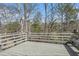 Spacious deck features a bench, offering a peaceful spot to enjoy the wooded views at 625 Sycamore Glen Nw Ct, Lawrenceville, GA 30044