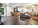 Spacious finished basement with a stylish bar area, wood-look tile flooring and comfortable sectional sofa at 625 Sycamore Glen Nw Ct, Lawrenceville, GA 30044