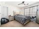 Bedroom with neutral carpet and light grey bedding at 625 Sycamore Glen Nw Ct, Lawrenceville, GA 30044