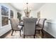 Formal dining room with elegant chandelier and seating for six; perfect for entertaining at 625 Sycamore Glen Nw Ct, Lawrenceville, GA 30044