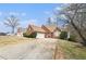 Lovely brick home featuring a well-manicured front lawn and a long driveway, plus an extra detached garage at 625 Sycamore Glen Nw Ct, Lawrenceville, GA 30044