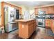 Functional kitchen features an island, stainless steel appliances, and wooden cabinetry at 625 Sycamore Glen Nw Ct, Lawrenceville, GA 30044