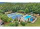 Overhead view of community pool, tennis courts and playground surrounded by lush landscaping at 1945 Wenlok Ne Trl, Marietta, GA 30066