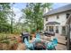 Well designed back deck with plenty of seating, a grill, and string lights at 1945 Wenlok Ne Trl, Marietta, GA 30066