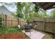 Cozy backyard patio with seating, perfect for enjoying the outdoors in a private setting at 1945 Wenlok Ne Trl, Marietta, GA 30066