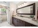 Bathroom featuring a granite countertop, large mirror, and shower with curtain at 1945 Wenlok Ne Trl, Marietta, GA 30066