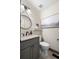 Modern half bathroom with stylish vanity, round mirror, and decorative lighting at 1945 Wenlok Ne Trl, Marietta, GA 30066