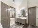 Well lit bathroom connecting to main bedroom featuring a double vanity and wood-look flooring at 1945 Wenlok Ne Trl, Marietta, GA 30066