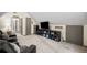 Bonus room with seating, television on stand with shelves, and three doors at 1945 Wenlok Ne Trl, Marietta, GA 30066