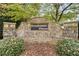 Stone community sign for Stockton's Chase set amongst bushes and fallen leaves at 1945 Wenlok Ne Trl, Marietta, GA 30066