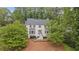 Charming two-story home with a landscaped yard and a welcoming front entrance at 1945 Wenlok Ne Trl, Marietta, GA 30066