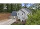 An aerial view of a home showing a two-car garage, driveway, and landscaped yard at 1945 Wenlok Ne Trl, Marietta, GA 30066